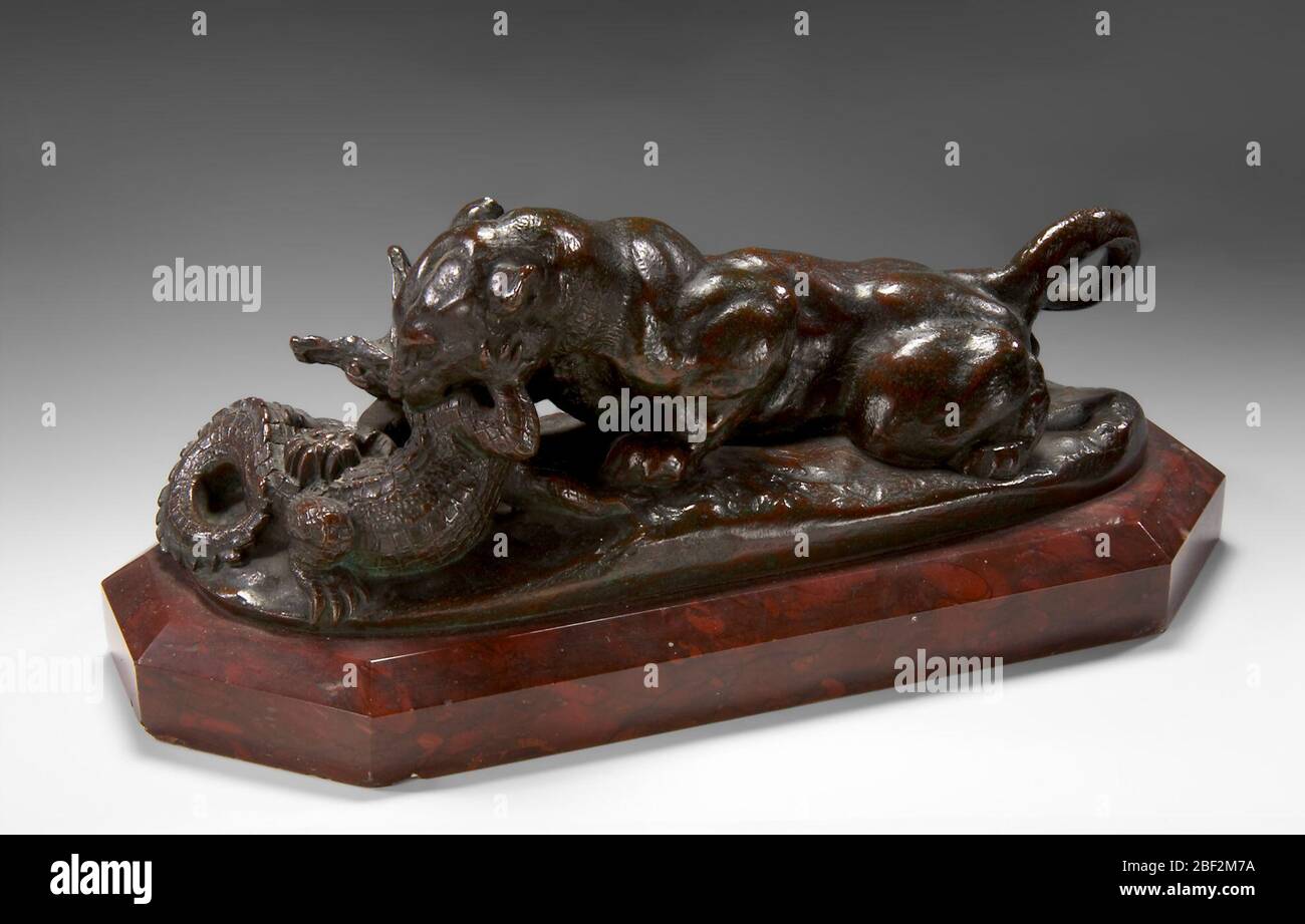 Jaguar Dévorer un crocodile. Antoine-Louis Barye a créé plus de cinquante sculptures de chats. Il a ciselé la surface et appliqué des patinas pour montrer les motifs et les textures de la fourrure de chaque animal. Banque D'Images