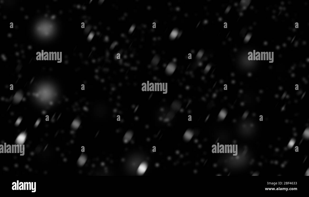 Neige blanche sur fond noir. Banque D'Images