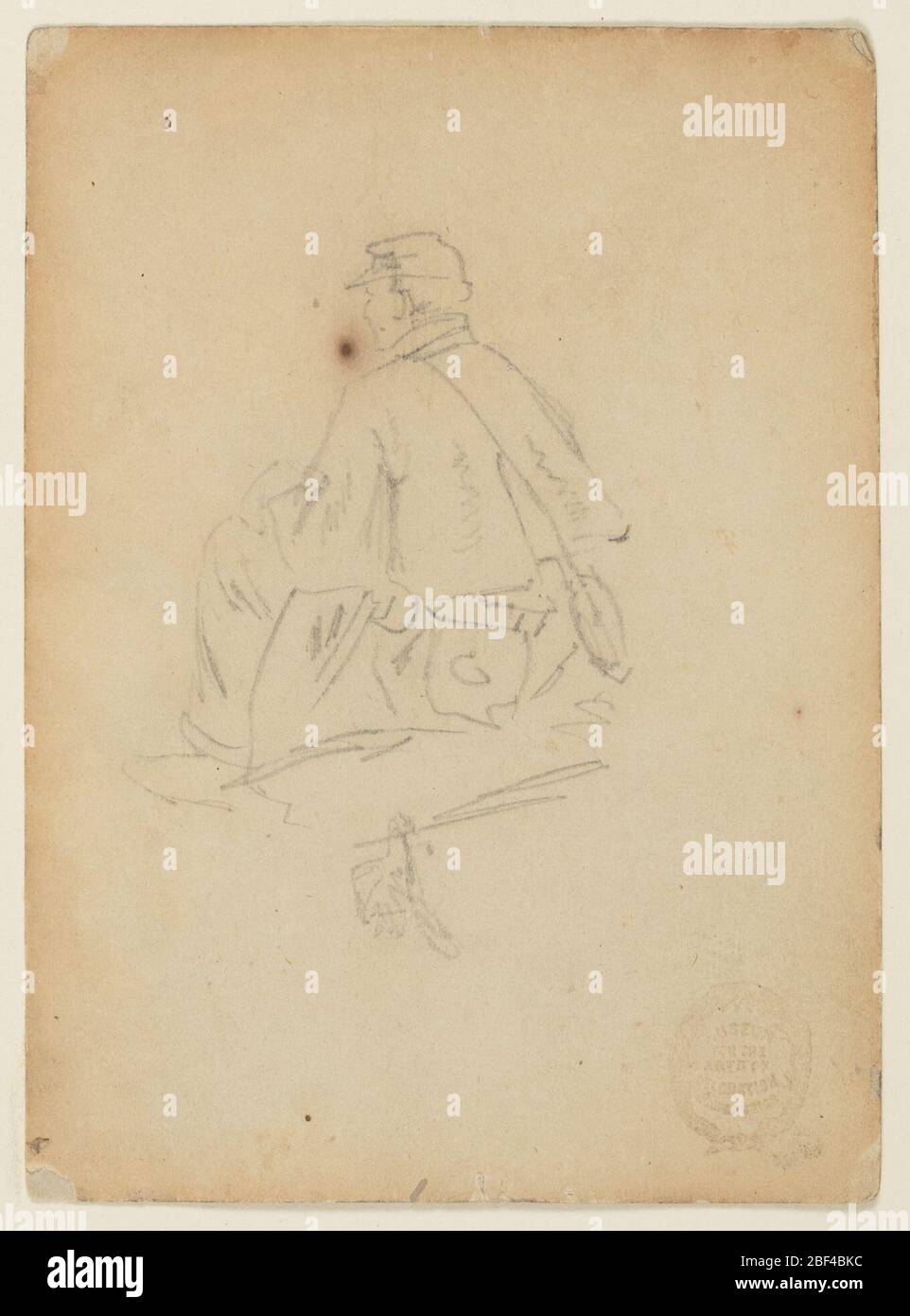 Soldat assis. Vue verticale d'un soldat assis, vue de l'arrière. Banque D'Images