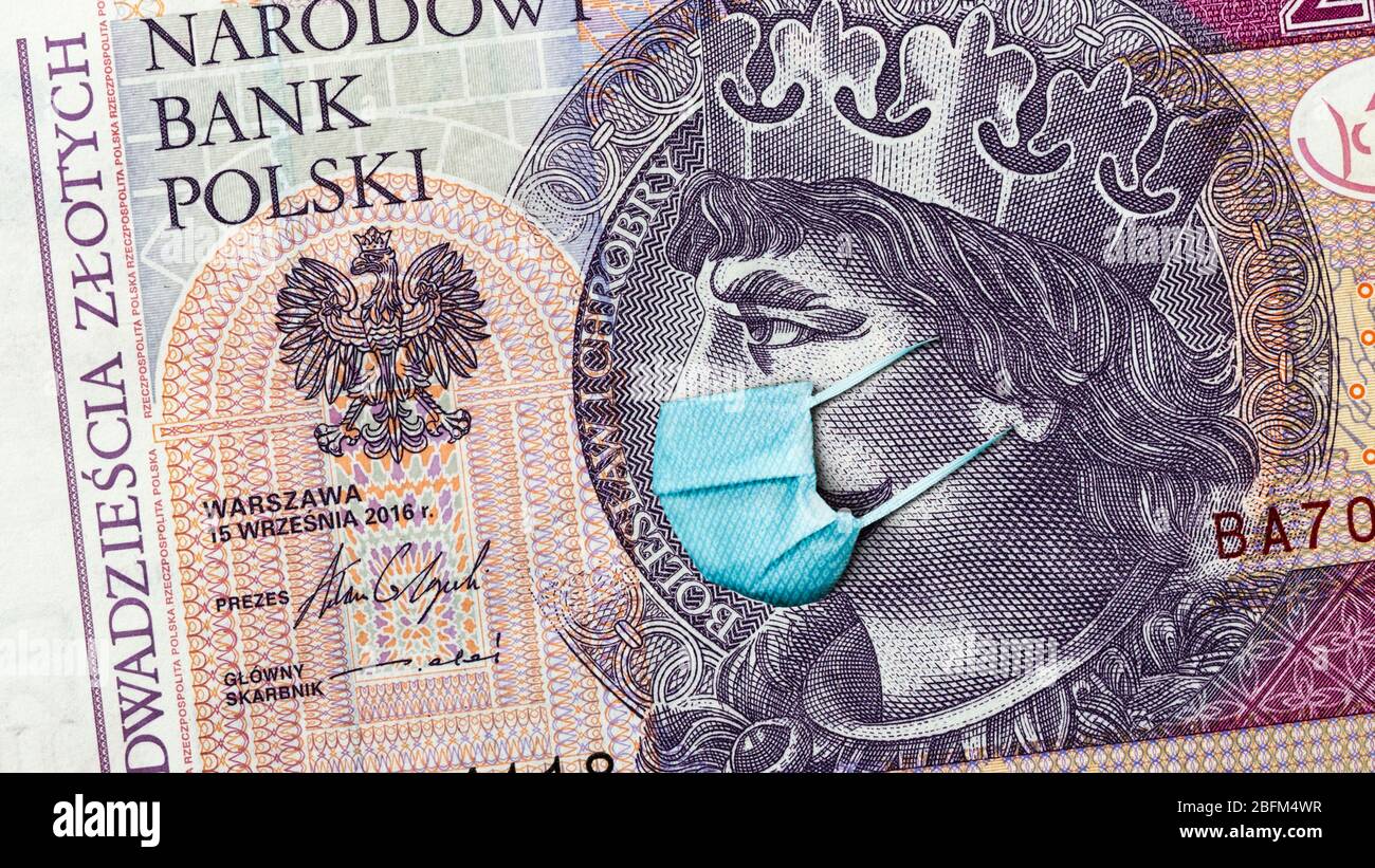 Coronavirus en Pologne. Quarantaine et récession mondiale. 20 billet de banque polonais à zloty avec masque facial contre l'infection. L'économie mondiale frappée par covid19. Banque D'Images