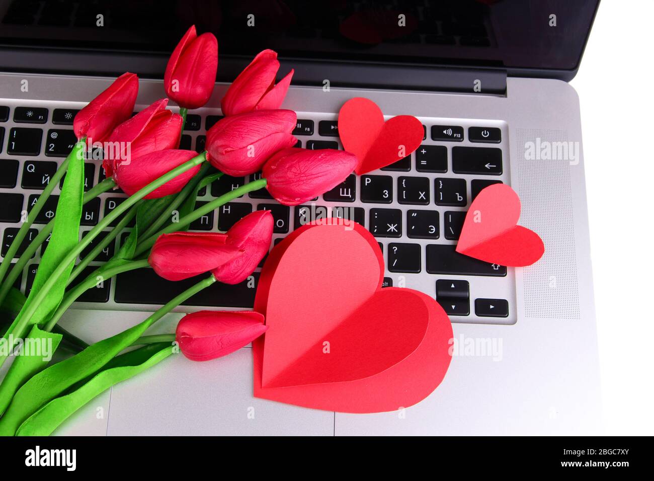 Coeurs et fleurs rouges sur le clavier d'ordinateur gros plan Photo Stock -  Alamy