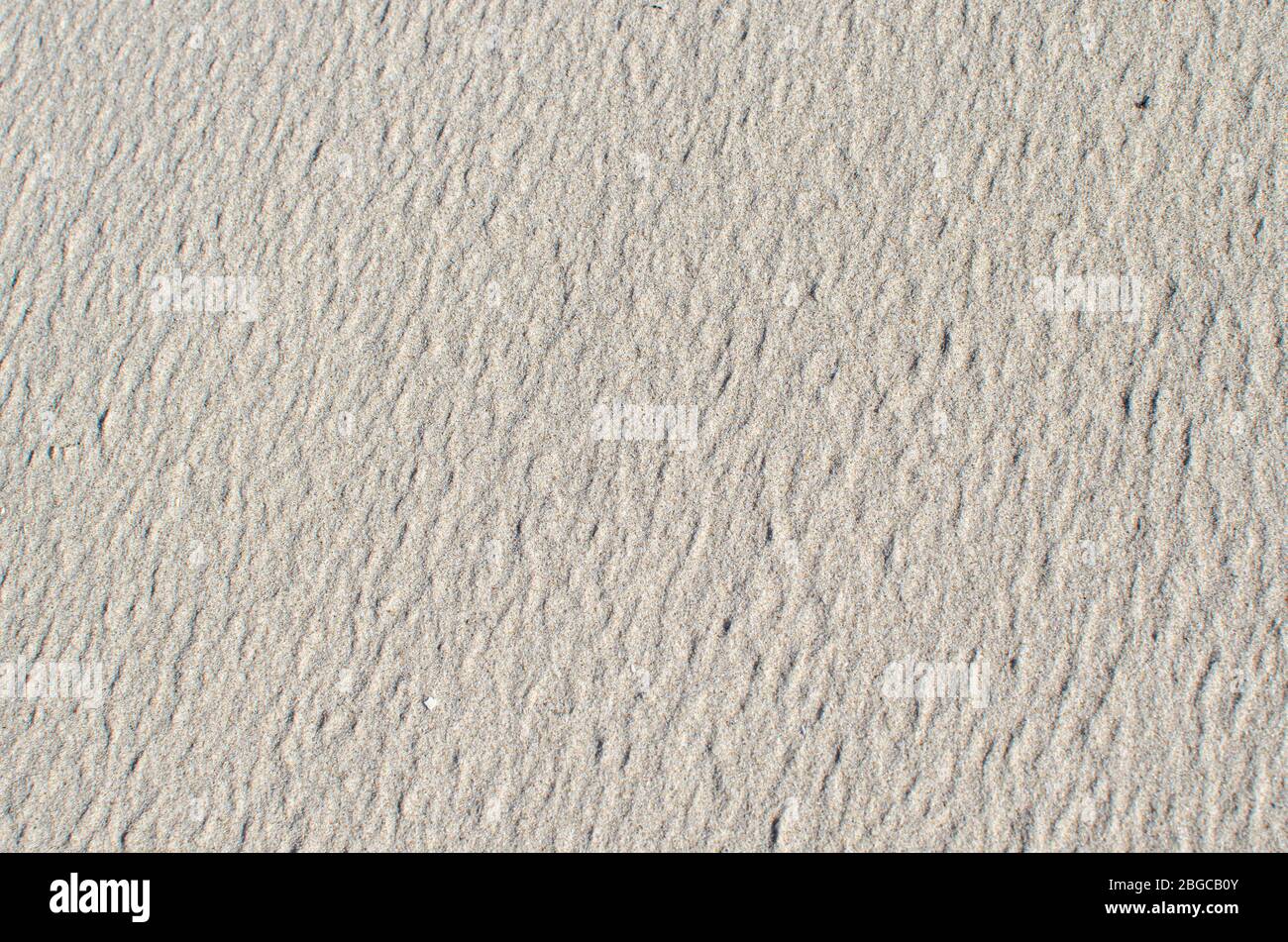 Texture de sable blanc ou jaune clair, arrière-plan Banque D'Images