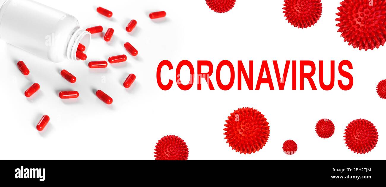 Pilules rouges sur fond blanc. Covid-19 de coronavirus. Pandémie du virus Corona Banque D'Images