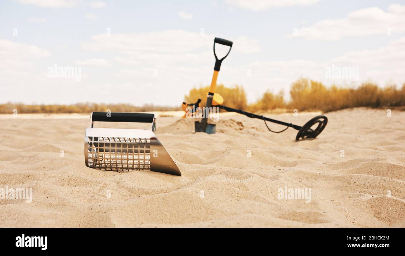 Ensemble d'outils utilisés pour explorer et creuser des métaux précieux  dans le sable. Détecteur de métaux, pelle et pelle. Copier l'espace Photo  Stock - Alamy