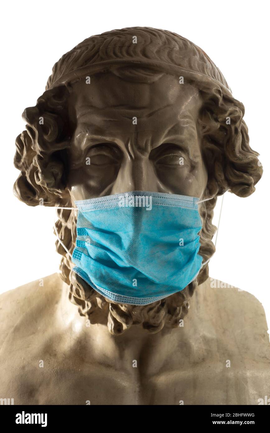 Copie en gypse de l'ancien Homer statue portant un masque de visage de virus Banque D'Images