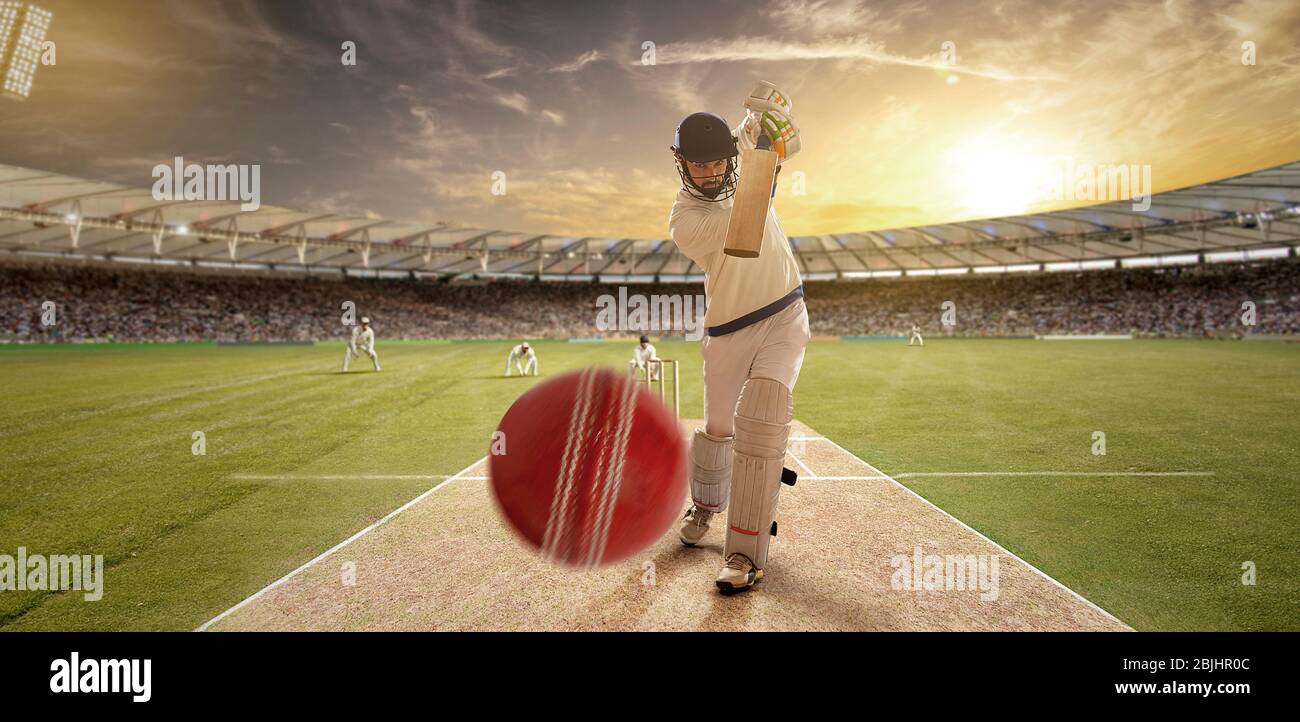 Un jeune sportif jouant au cricket avec la position de frapper le ballon Banque D'Images