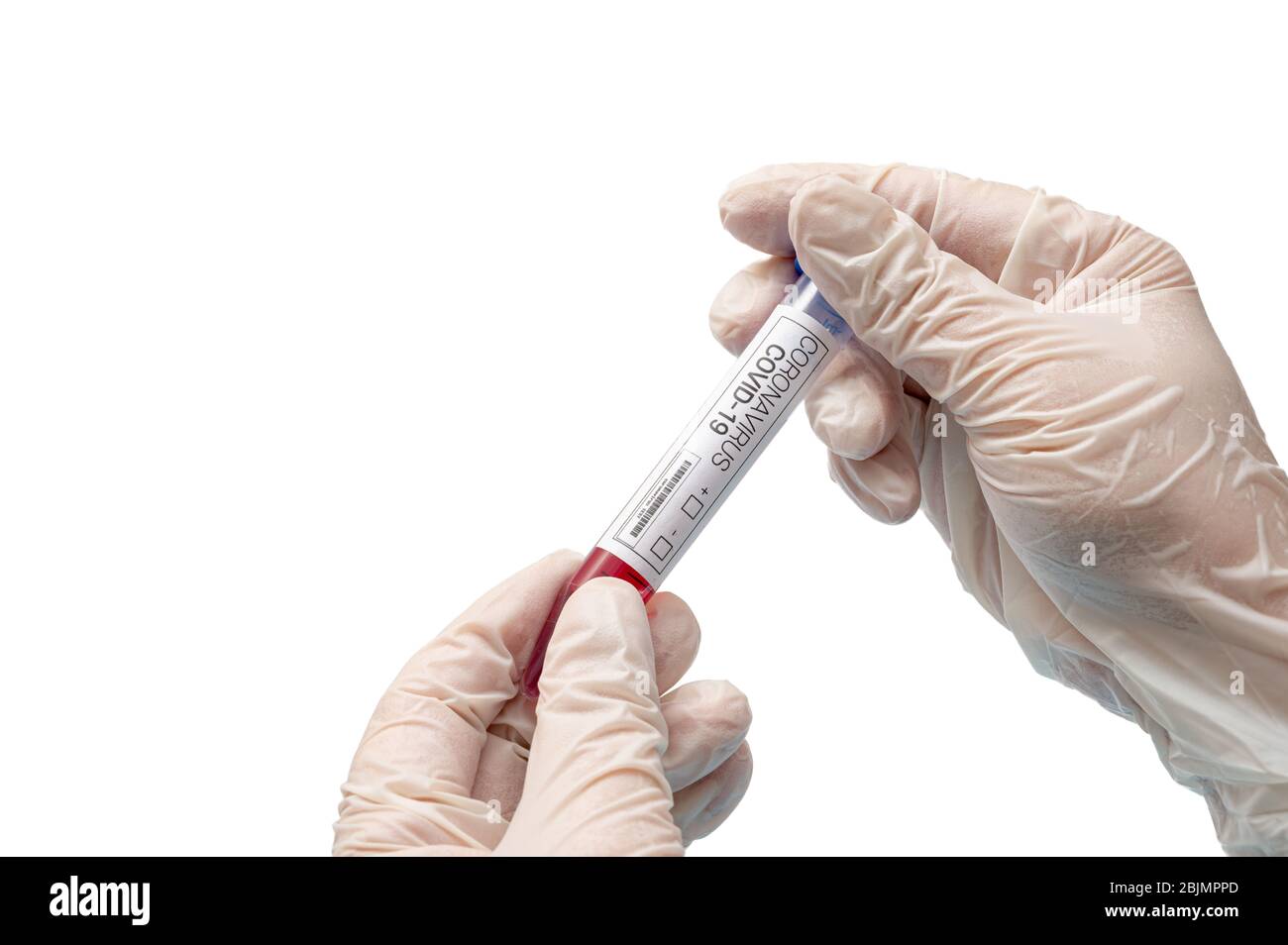 Une main portant un gant en latex blanc et tenant un kit de test de coronavirus. Concept de pandémie infectieuse. Banque D'Images