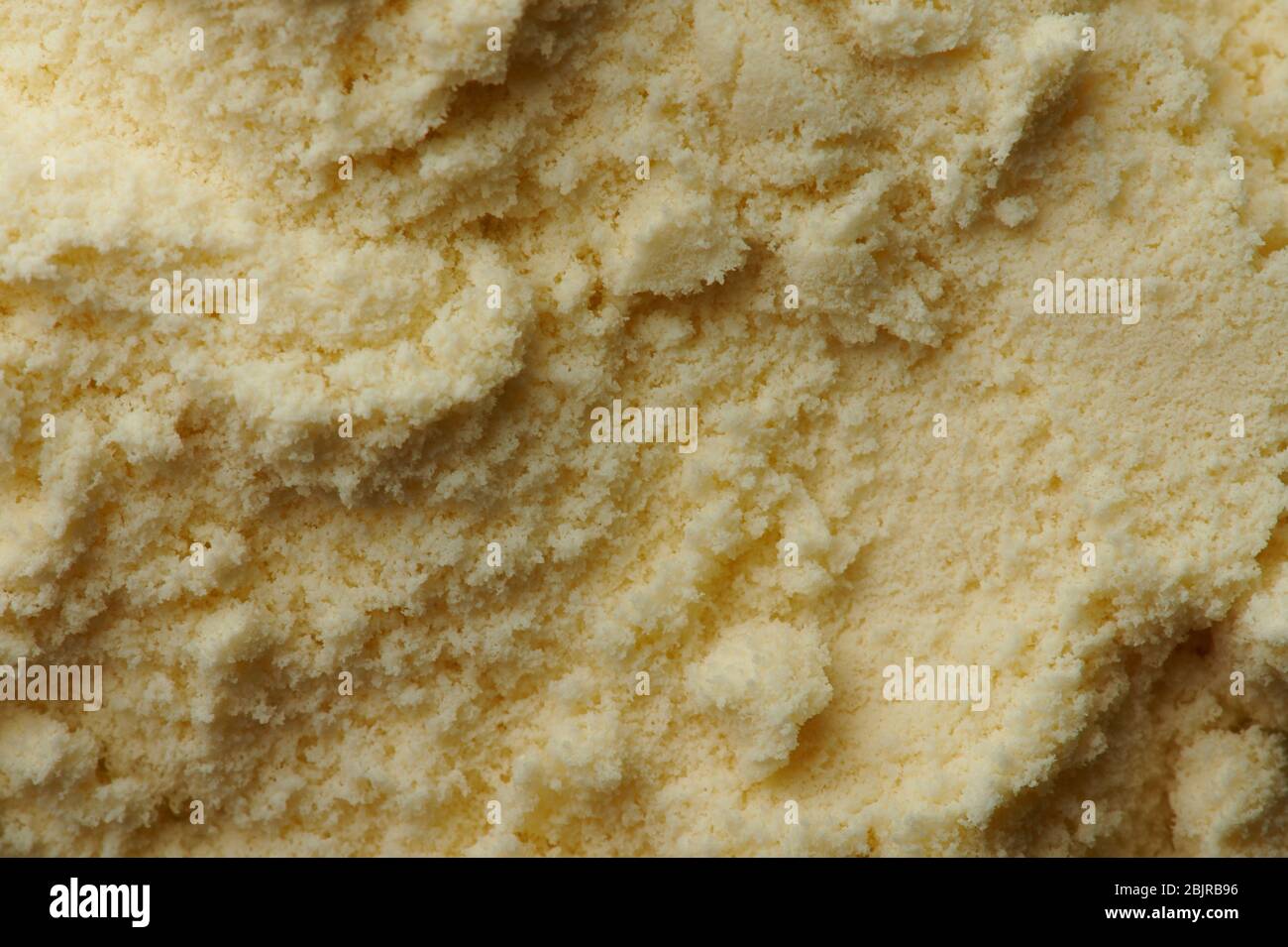 Texture de la poudre de lait jaune macro vue rapprochée Banque D'Images
