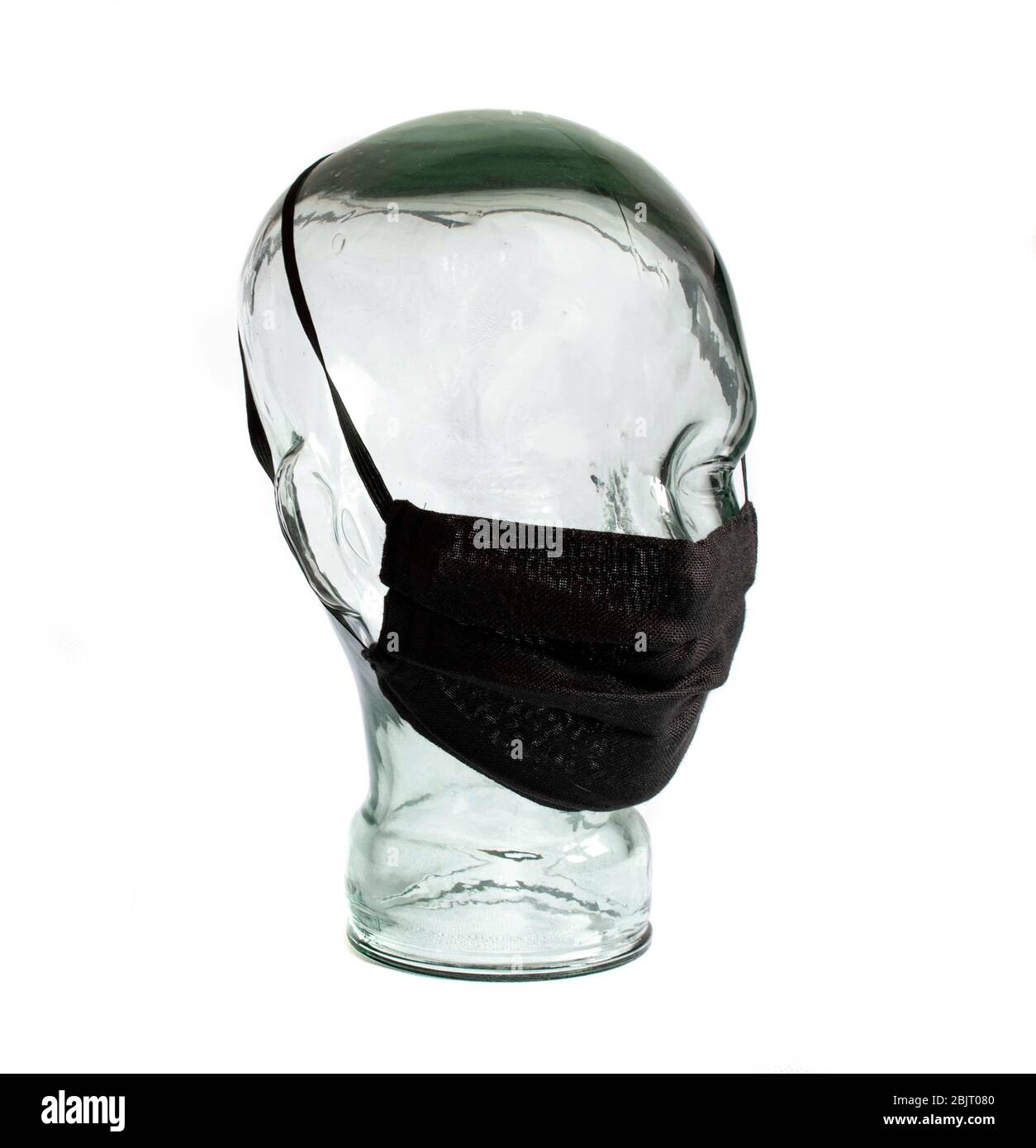 Masques de protection pour le visage sur une tête en verre sans visage EPI Personal Protective Equipment fond blanc Banque D'Images