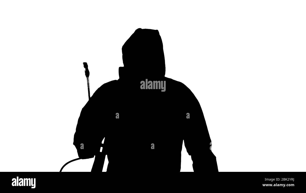 Silhouette virologue dans la marche uniforme de protection et la désinfection de la zone. Banque D'Images