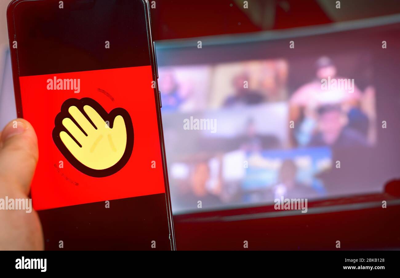 Utilisation manuelle de l'icône de l'application de vidéoconférence de Houseparty . Banque D'Images