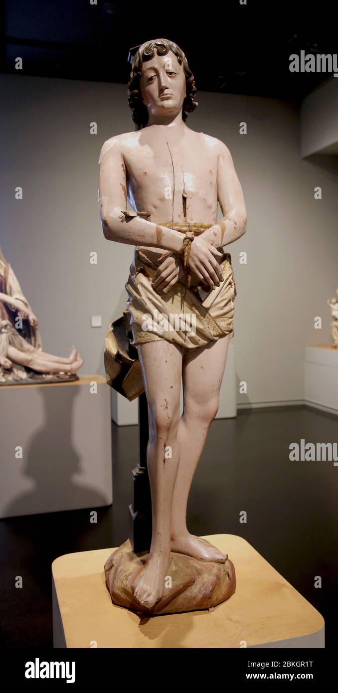 Saint Sébastien martyr, sculpture en bois polychrome (fin du 15ème cent.) par Alejo de Vahia Museuu Frédéric Marés, Barcelone, Catalogne, Espagne. Banque D'Images