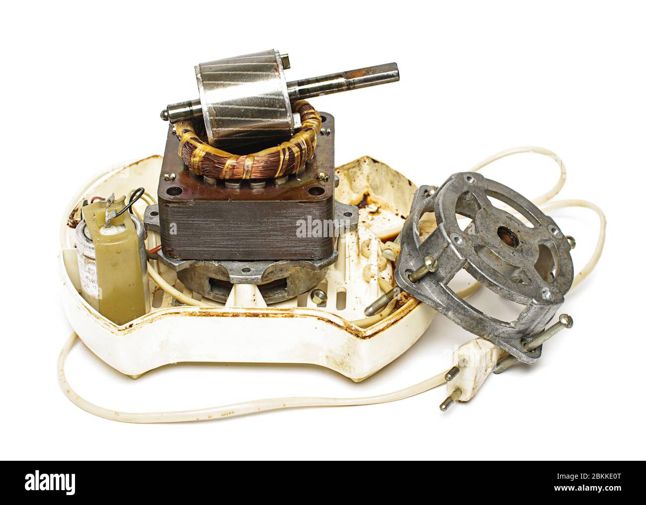 Le moteur de l'ancienne centrifugeuse rétro a été déconstruit sur un fond blanc Banque D'Images