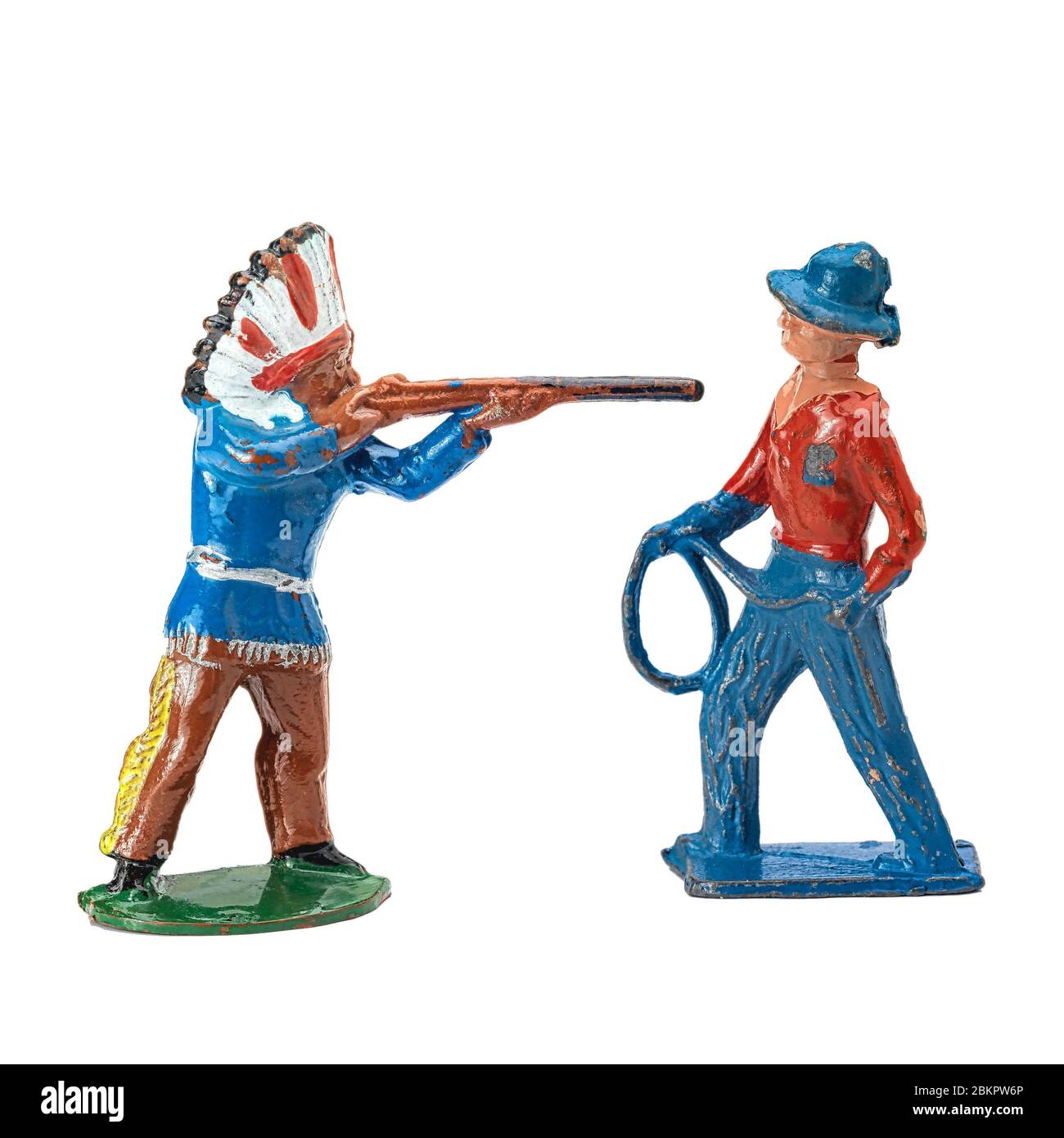 Amérindien visant son fusil à un Cowboy, Toys Banque D'Images