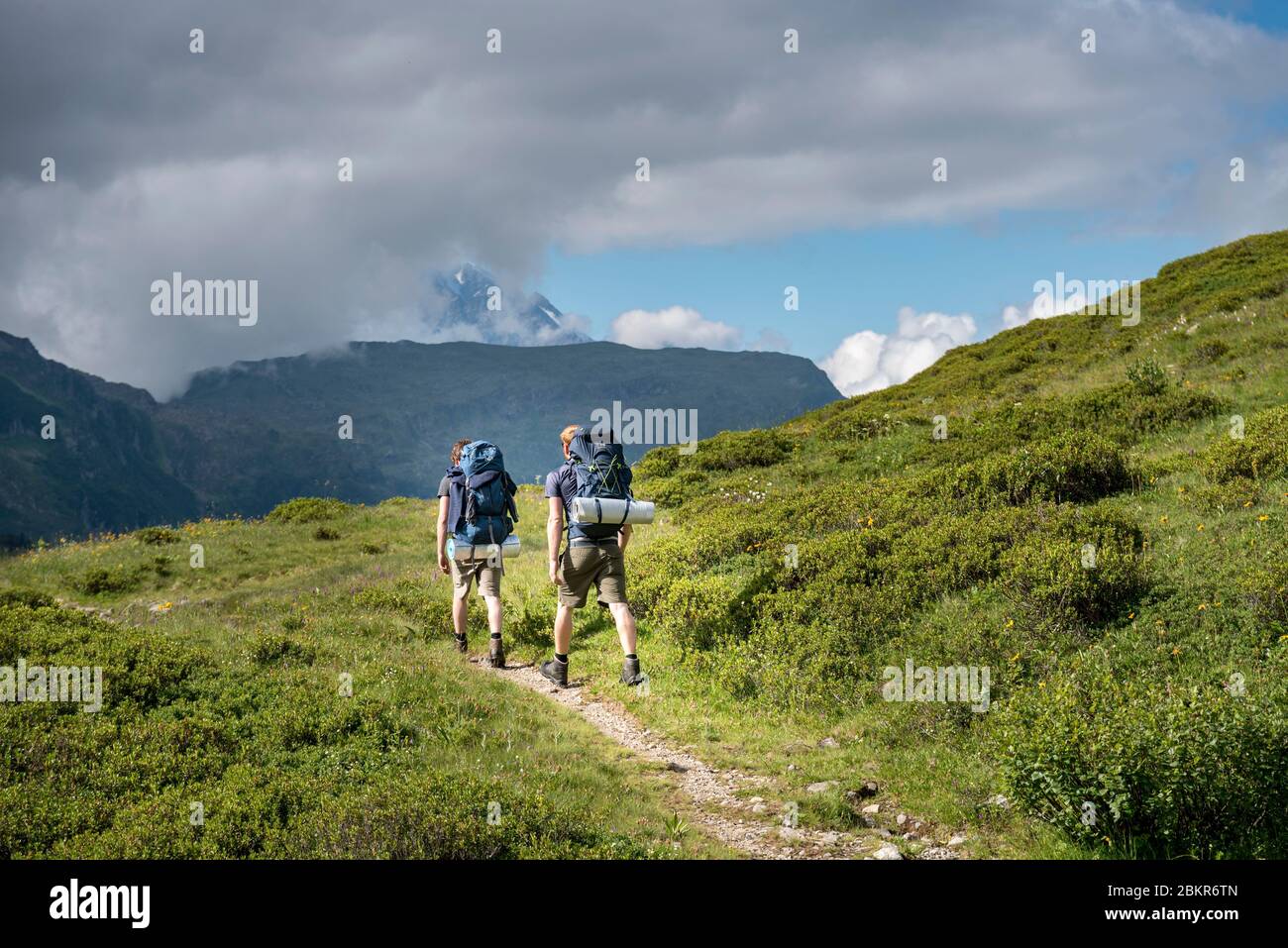 France, haute-Savoie (74), Passy, Plaine Joux, randonneurs grimpant vers le col de Salenton Banque D'Images