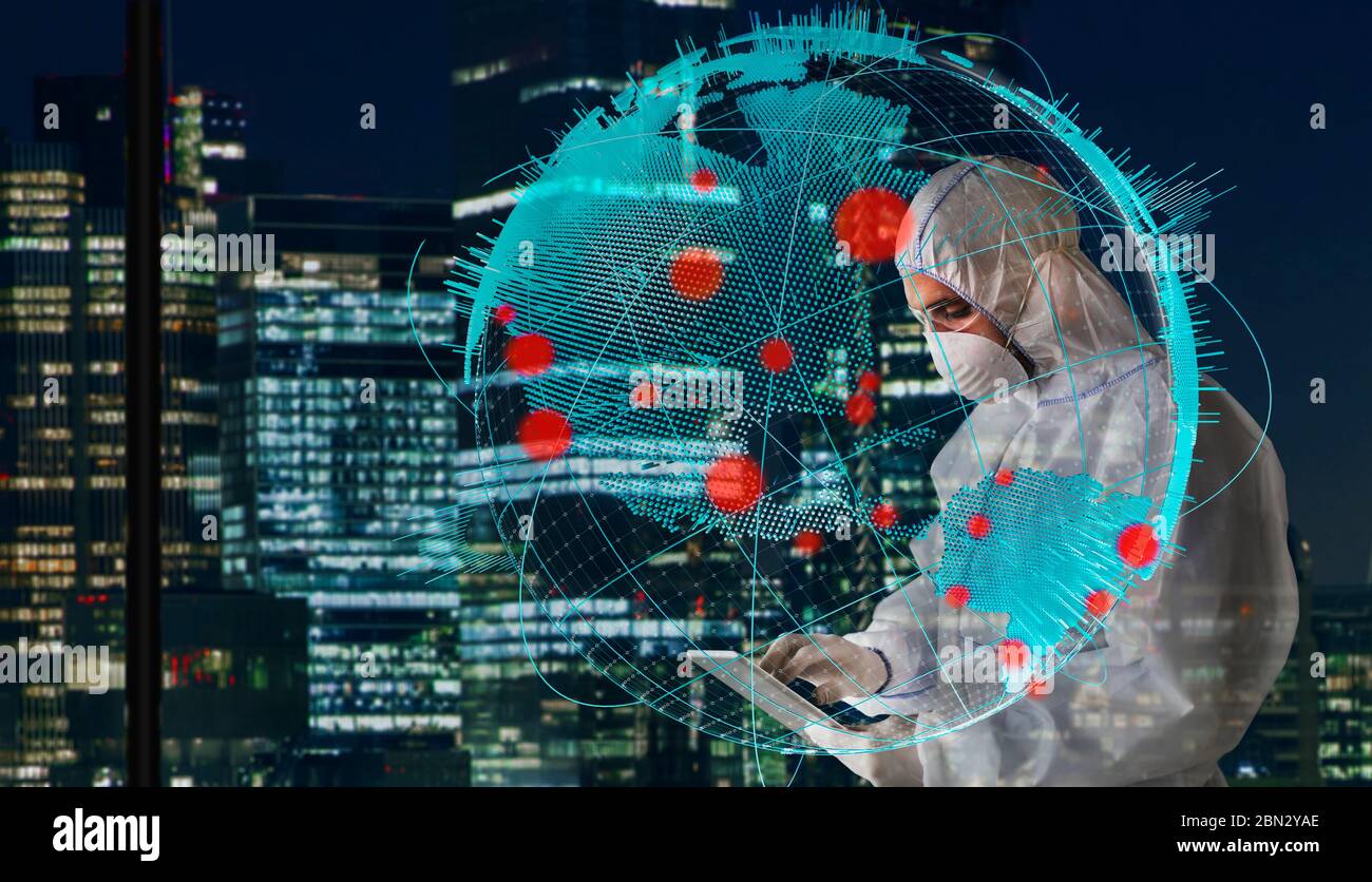 Scientifique en costume propre travaillant tard étudiant l'épidémie mondiale de coronavirus Banque D'Images