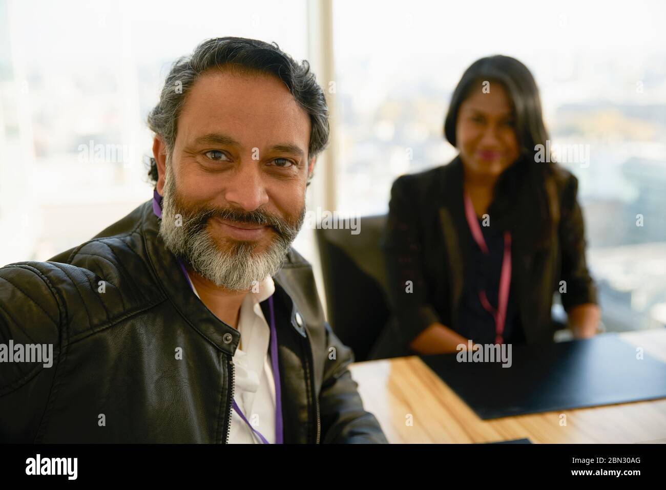 Portrait confident businessman in conference room Banque D'Images