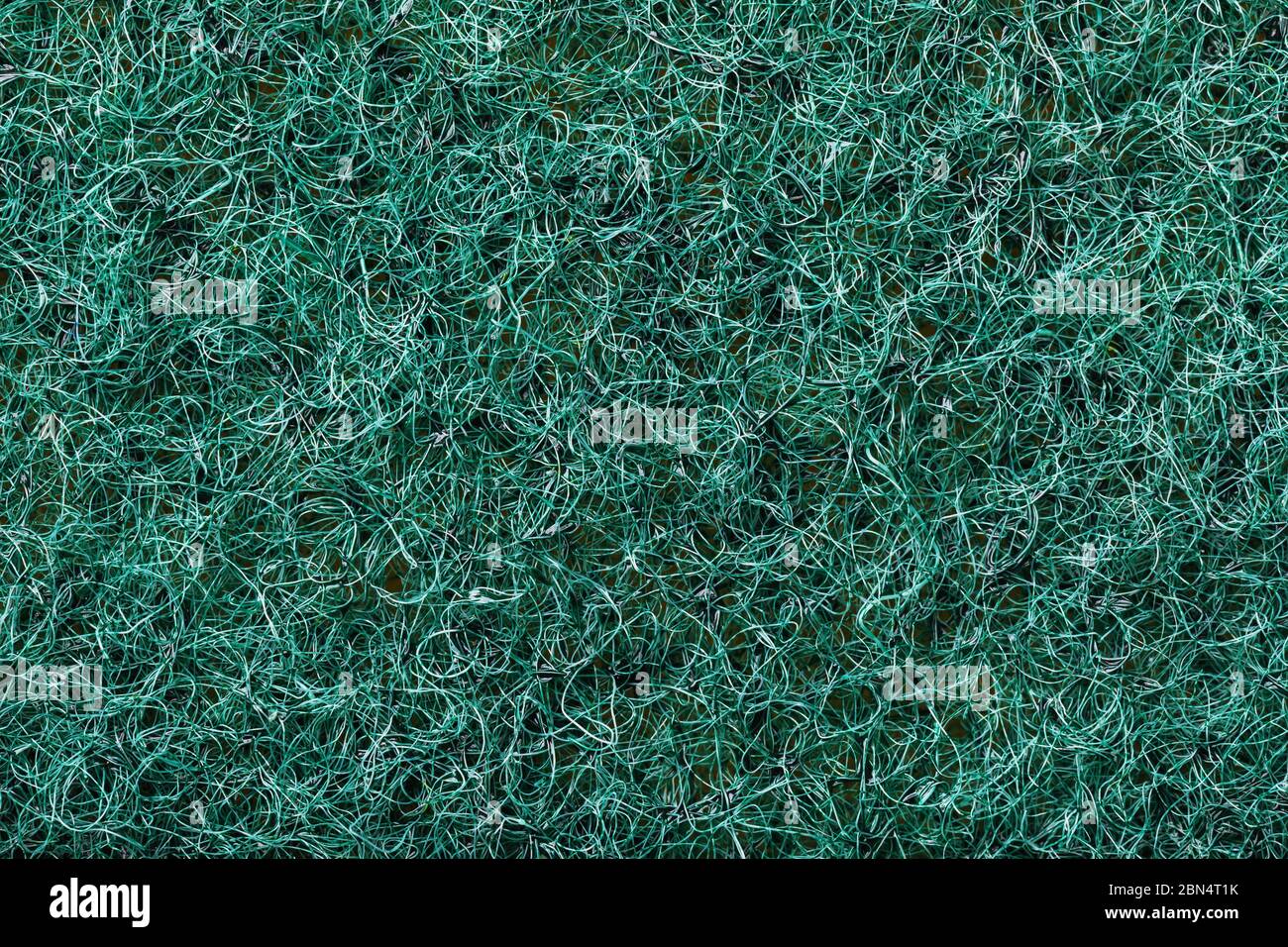 Texture de la face abrasive d'une éponge à vaisselle, gros plan Banque D'Images