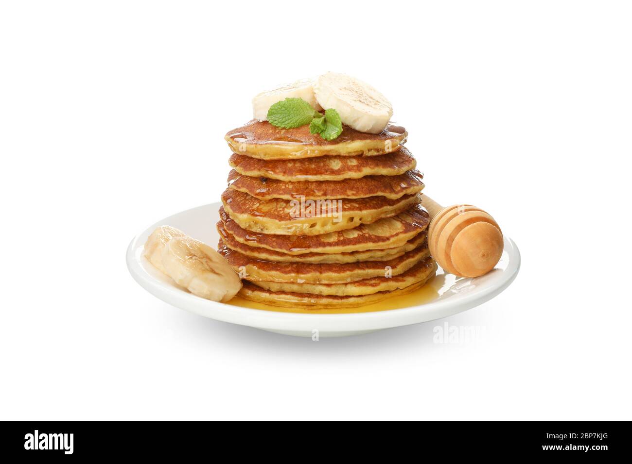 Crêpes savoureuses avec banane et miel isolées sur fond blanc Banque D'Images