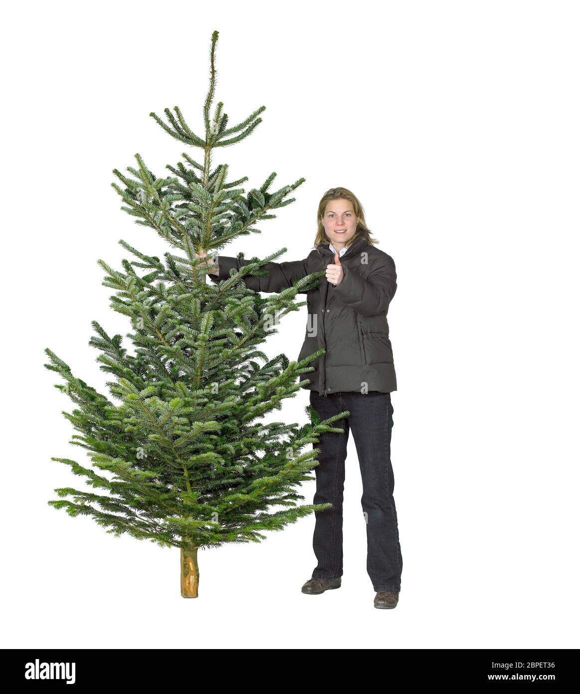 Jeune femme et l'arbre de Noël en blanc retour Banque D'Images