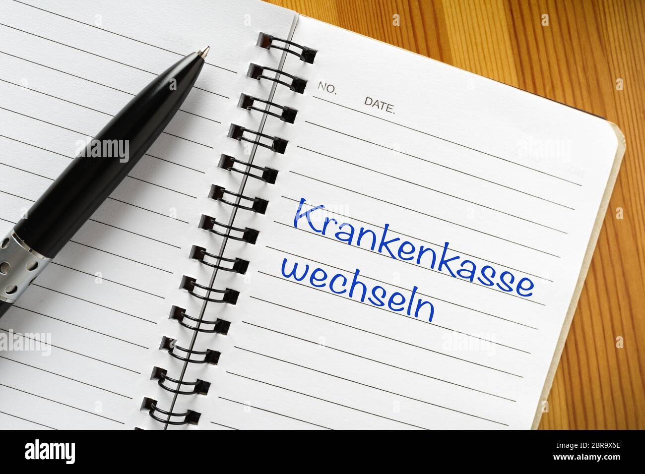 Bloc-notes avec expression allemande "Krankenkasse wechseln". Traduction : Santé de l'interrupteur Banque D'Images