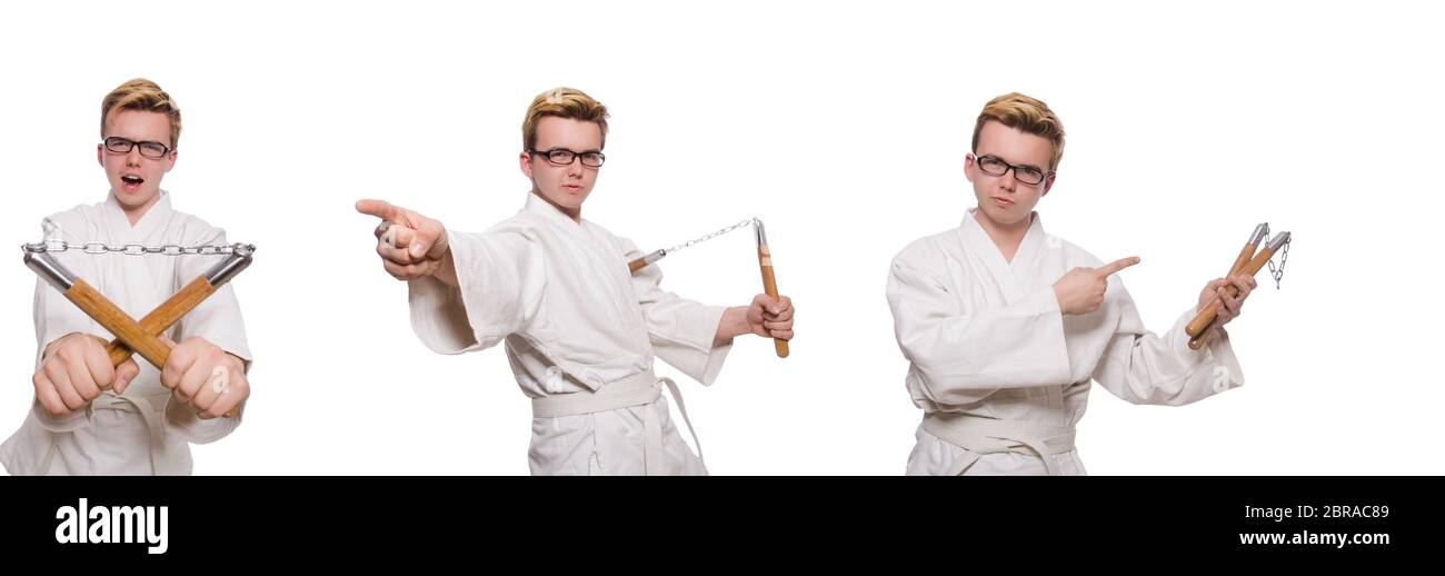 Le funny karate fighter avec nunchucks on white Banque D'Images
