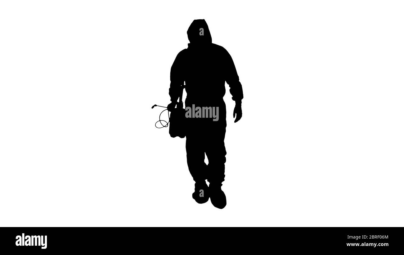 Silhouette virologue dans la marche uniforme de protection et la désinfection de la zone. Banque D'Images