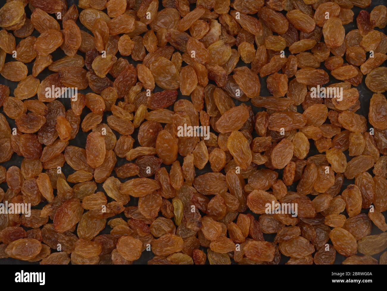 Raisins secs biologiques, jaune est la plus haute qualité. Fond ou papier peint délicieux. Banque D'Images