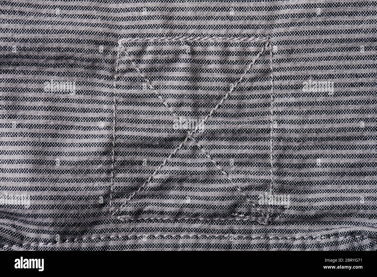 Fond textile gris avec coutures patch macro vue rapprochée Banque D'Images