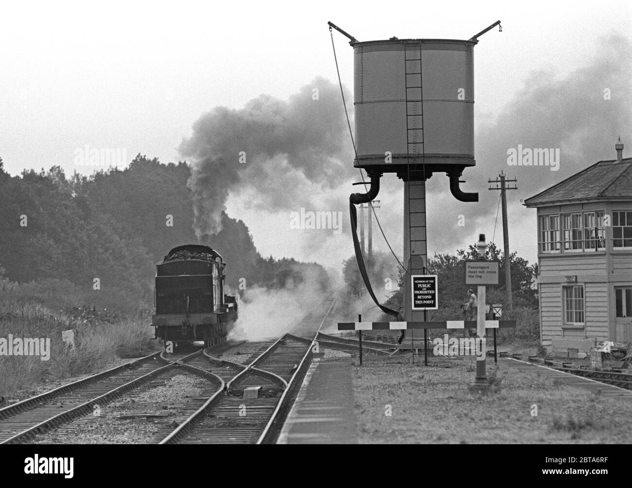 Prendre l'eau à la gare de Minehead sur le West Somerset Heritage Railway, Somerset, Angleterre Banque D'Images