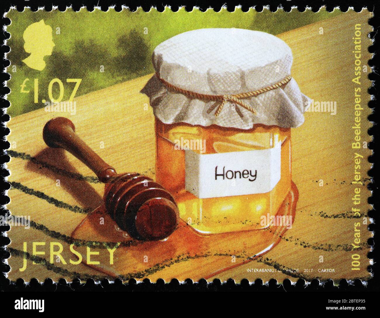 Pot de miel sur timbre-poste de Jersey Banque D'Images