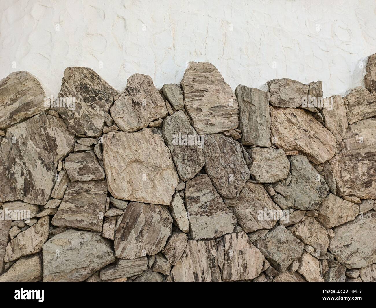 Mur en pierre naturelle, espace de copie - structures comme arrière-plan. Banque D'Images