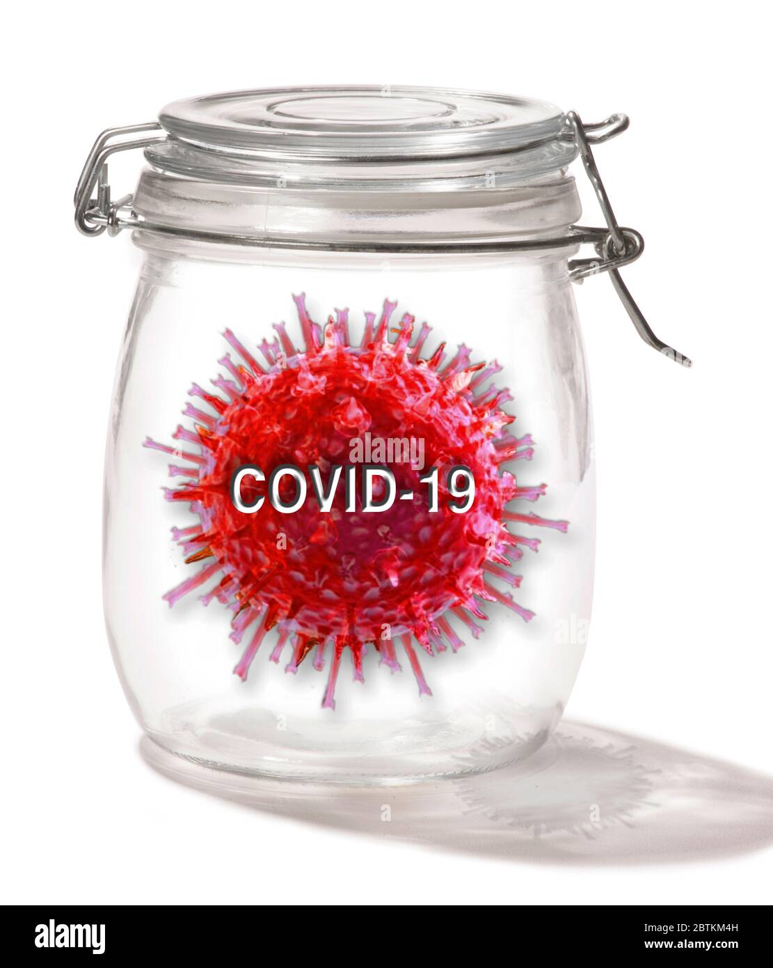 Pandémie COVID-19 dans un pot en verre. Banque D'Images
