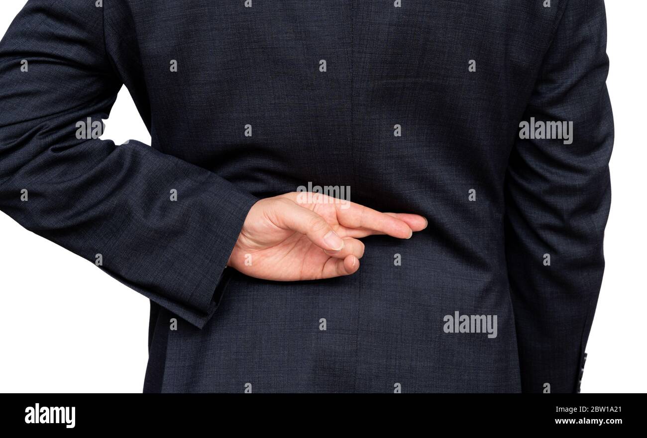 Homme d'affaires malhonnête qui dit des mensonges, mentant homme d'affaires tenant les doigts croisés derrière son dos. Banque D'Images