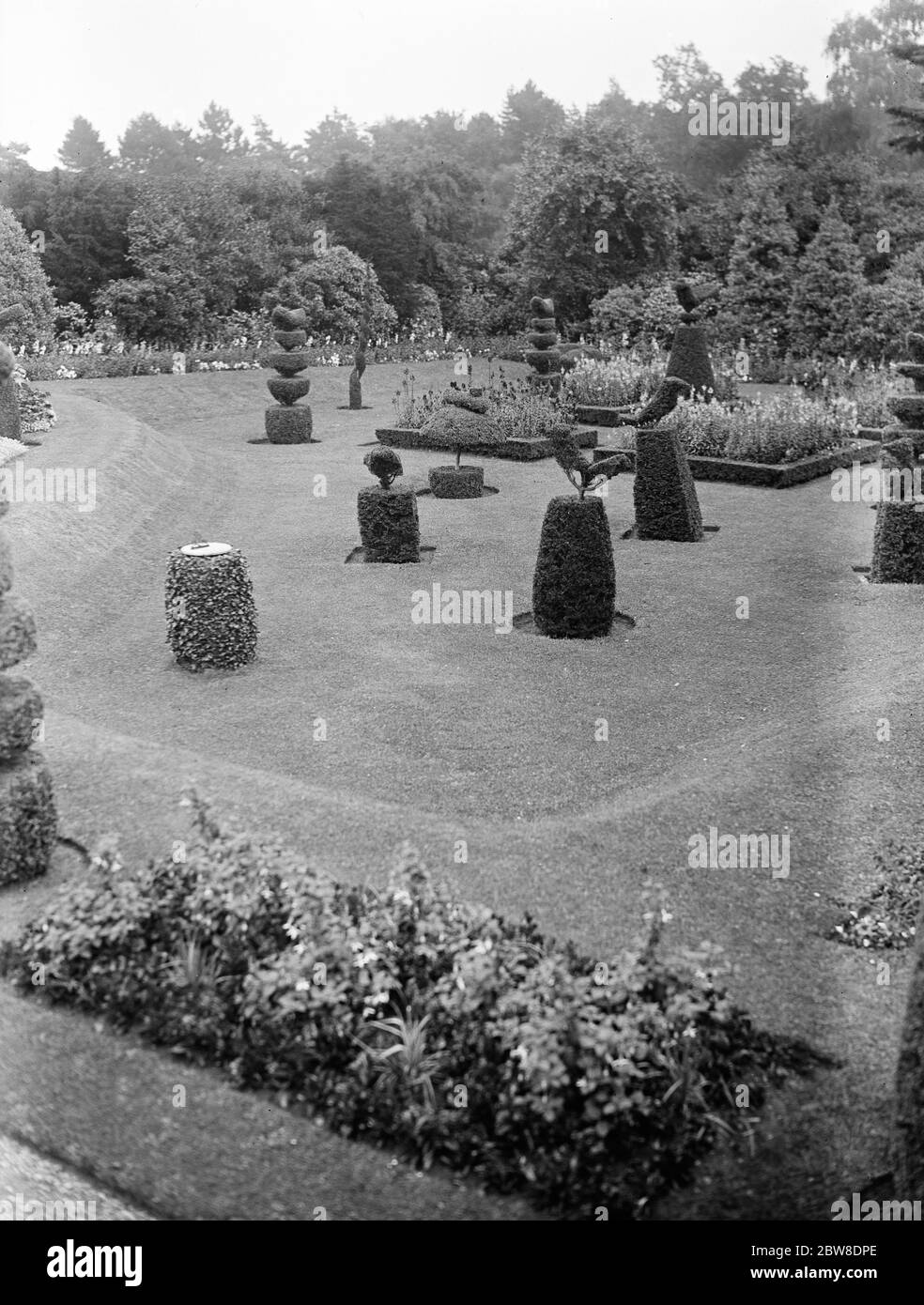 Le Roi et la Reine pour aller à Sandringham , Norfolk . Le pittoresque travail topiaire dans les jardins de Sandringham . 22 août 1929 Banque D'Images