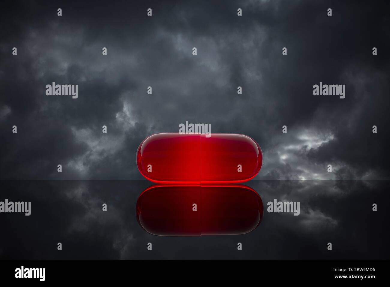 Pilule rouge sur fond nuageux Banque D'Images