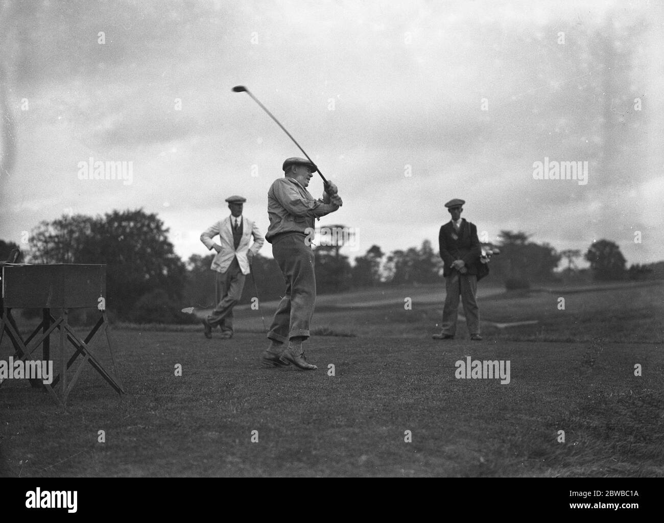 Golf tennis sur gazon joueurs au parc Woodcote M. L J Chilingworth Banque D'Images
