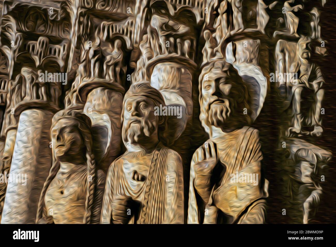 Statues de figures illustrant des thèmes théologiques et des récits clés à côté de l'entrée principale de la cathédrale de Chartres, en France. Banque D'Images