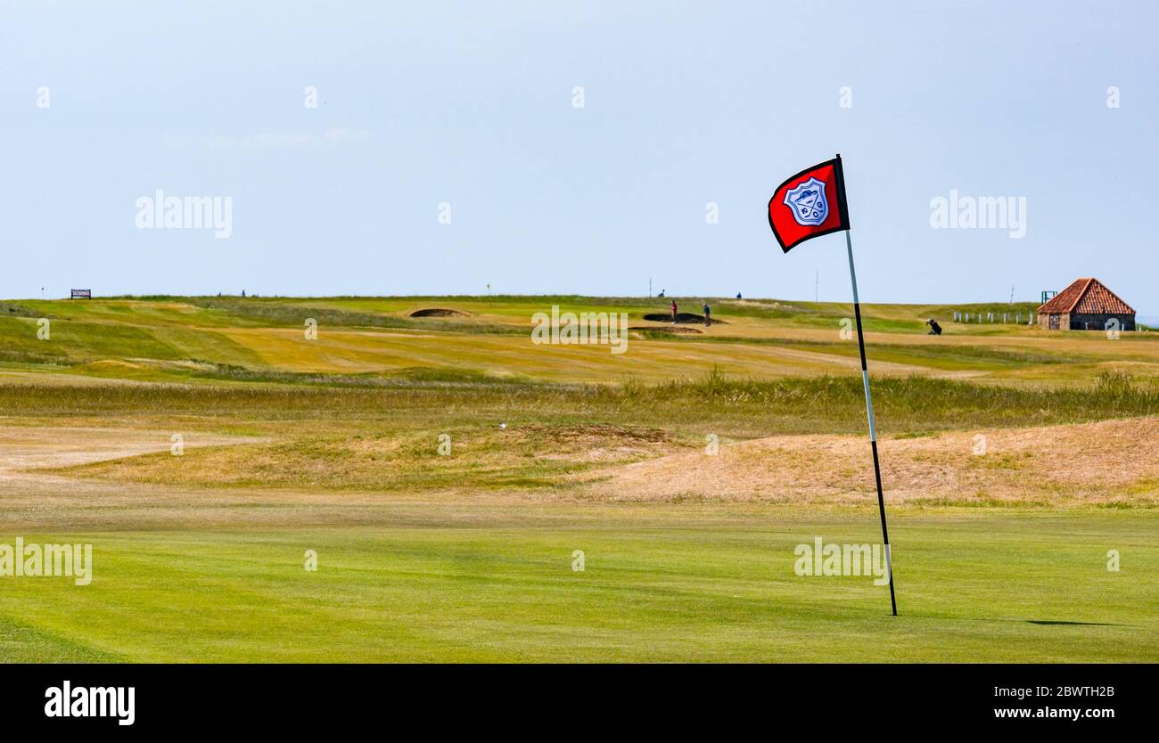 Parcours de golf de Kilspindie, vert d'exercice du 18e trou avec drapeau, East Lothian, Écosse, Royaume-Uni Banque D'Images