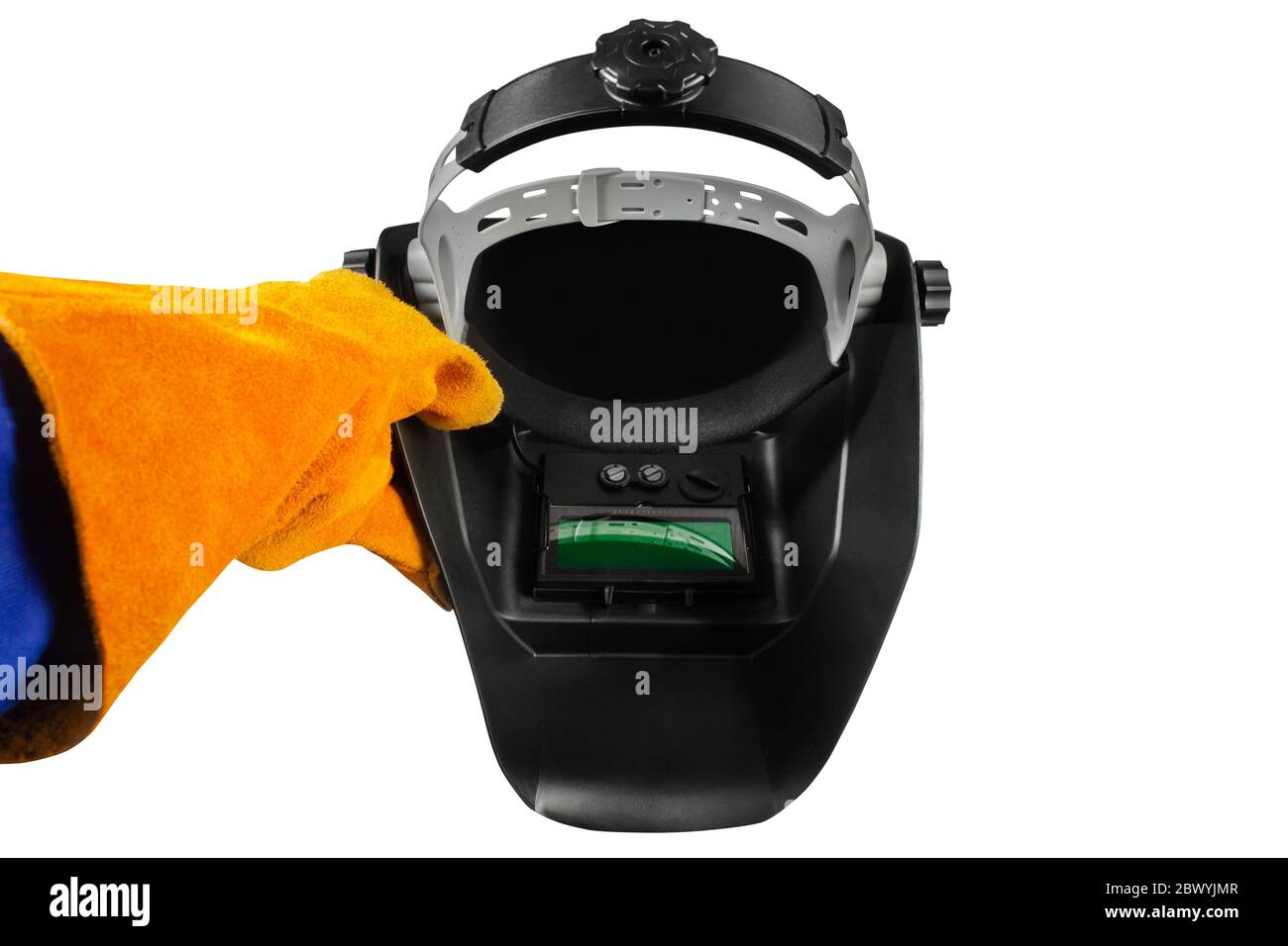 La première personne peut voir la photo d'un travailleur en robe et gants orange tenant le masque de soudage. Banque D'Images