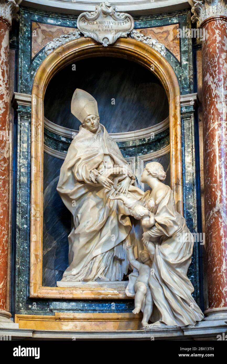 La Carita' di Tommaso da Villanova (1663-69) la Charité Saint-Thomas dans la Basilique Saint-Augustin à Campo Marzio - Rome, Italie marbre Banque D'Images