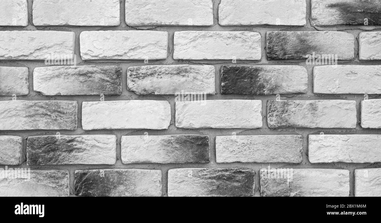 Mur en briques noir et blanc, loft. Mur en brique simple et haut de gamme. Fond ou texture qualitatif pour les meilleurs projets. Banque D'Images