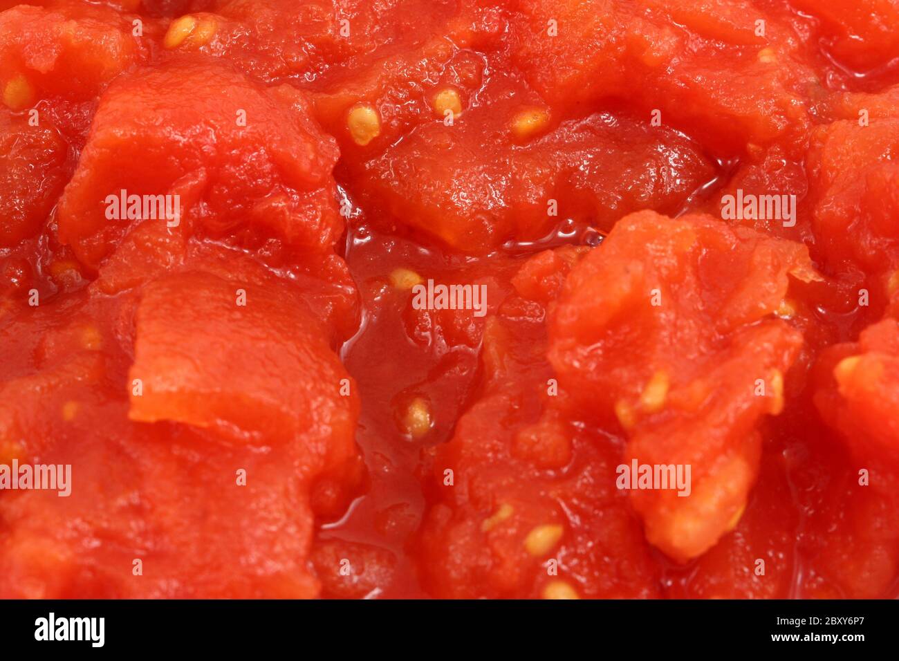 Une tomate en dés macro fond Banque D'Images