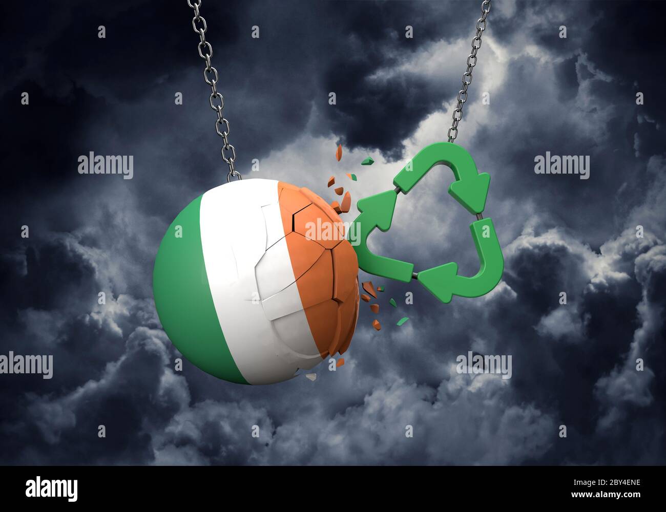 Le symbole de recyclage vert s'écrasant dans une boule de drapeau irlandais. Rendu 3D Banque D'Images