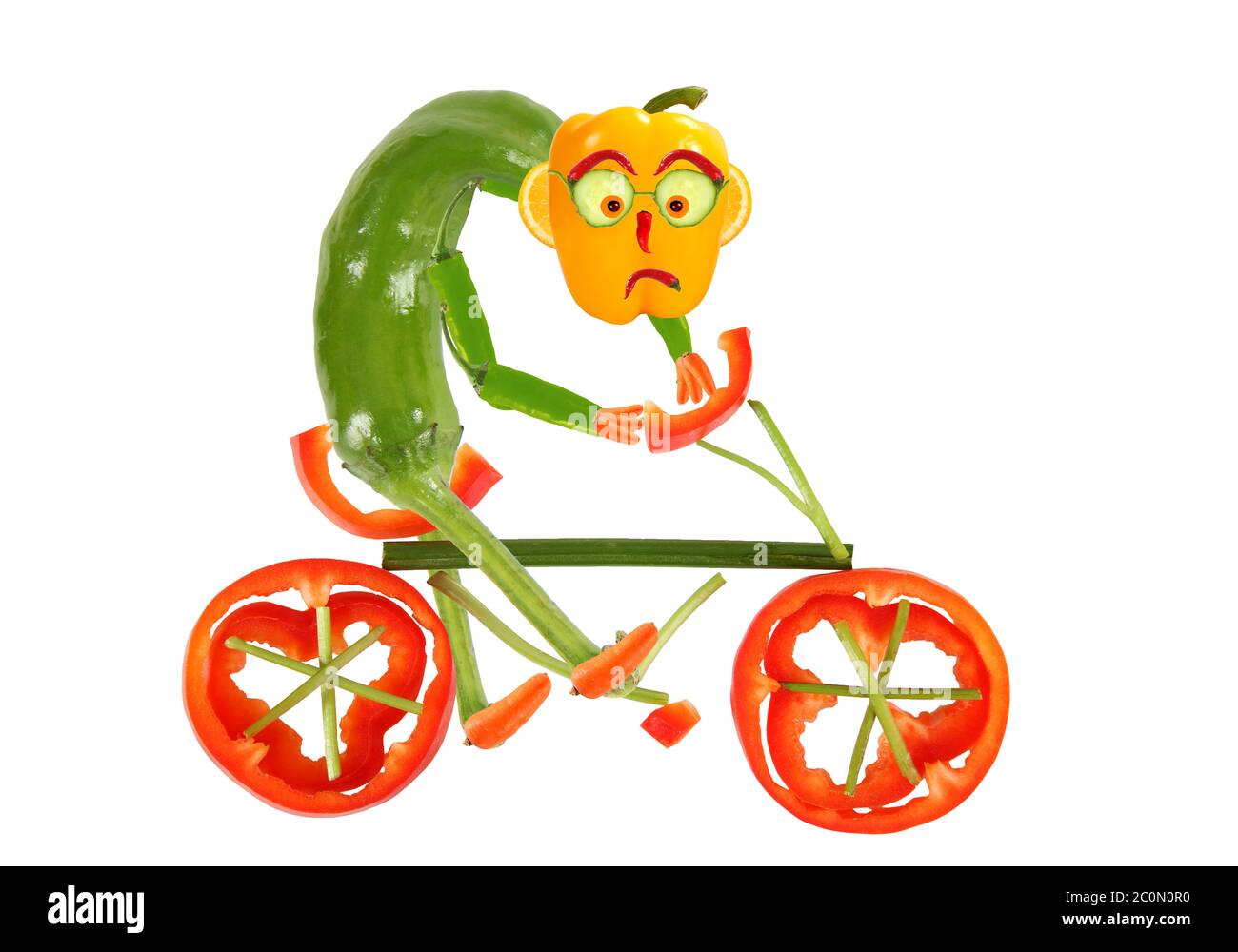 Une alimentation saine. Un petit poivre amusant sur un vélo Banque D'Images