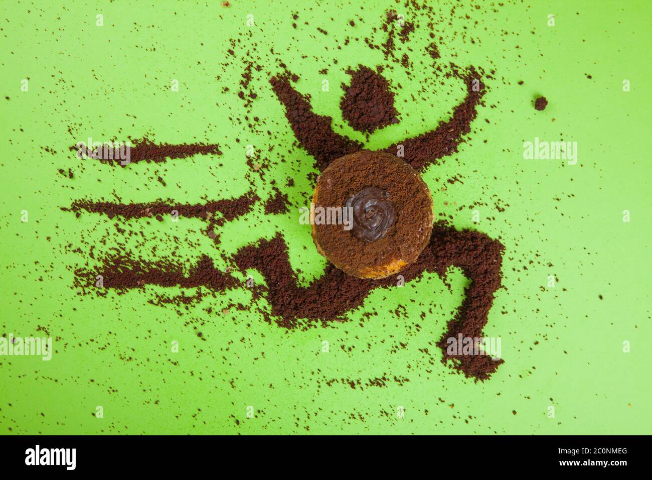 Beignet au chocolat graphique icône de livman avec une saupoudrer de cacao sur fond vert Banque D'Images