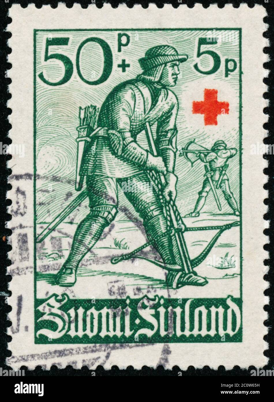 POLTAVA, UKRAINE - 12 juin 2020. Timbre vintage imprimé en Finlande vers 1940 montre la Croix-Rouge charité - soldats Banque D'Images