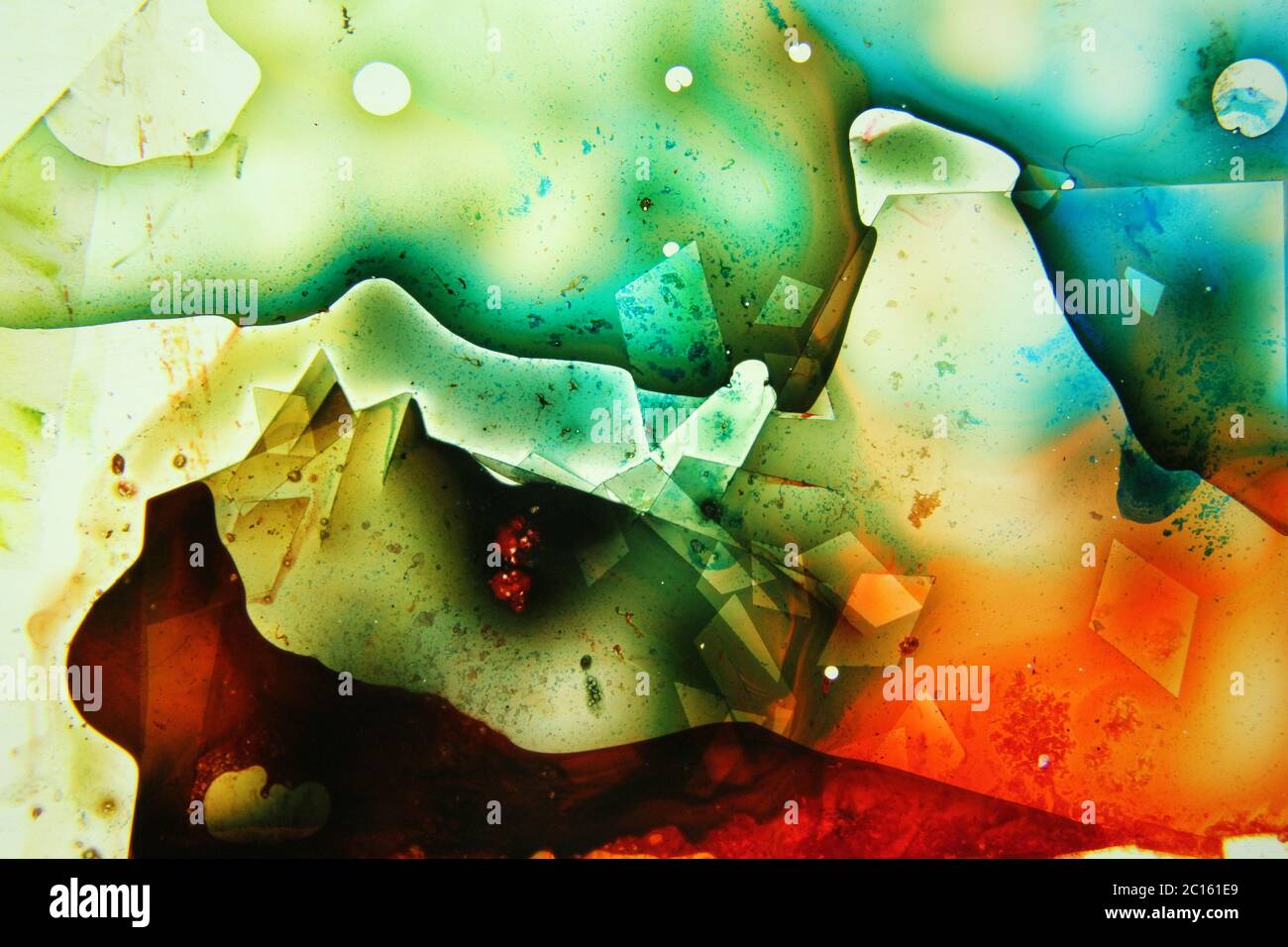 Liquides colorés mélangés dans un fluide créant une peinture abstraite colorée Banque D'Images