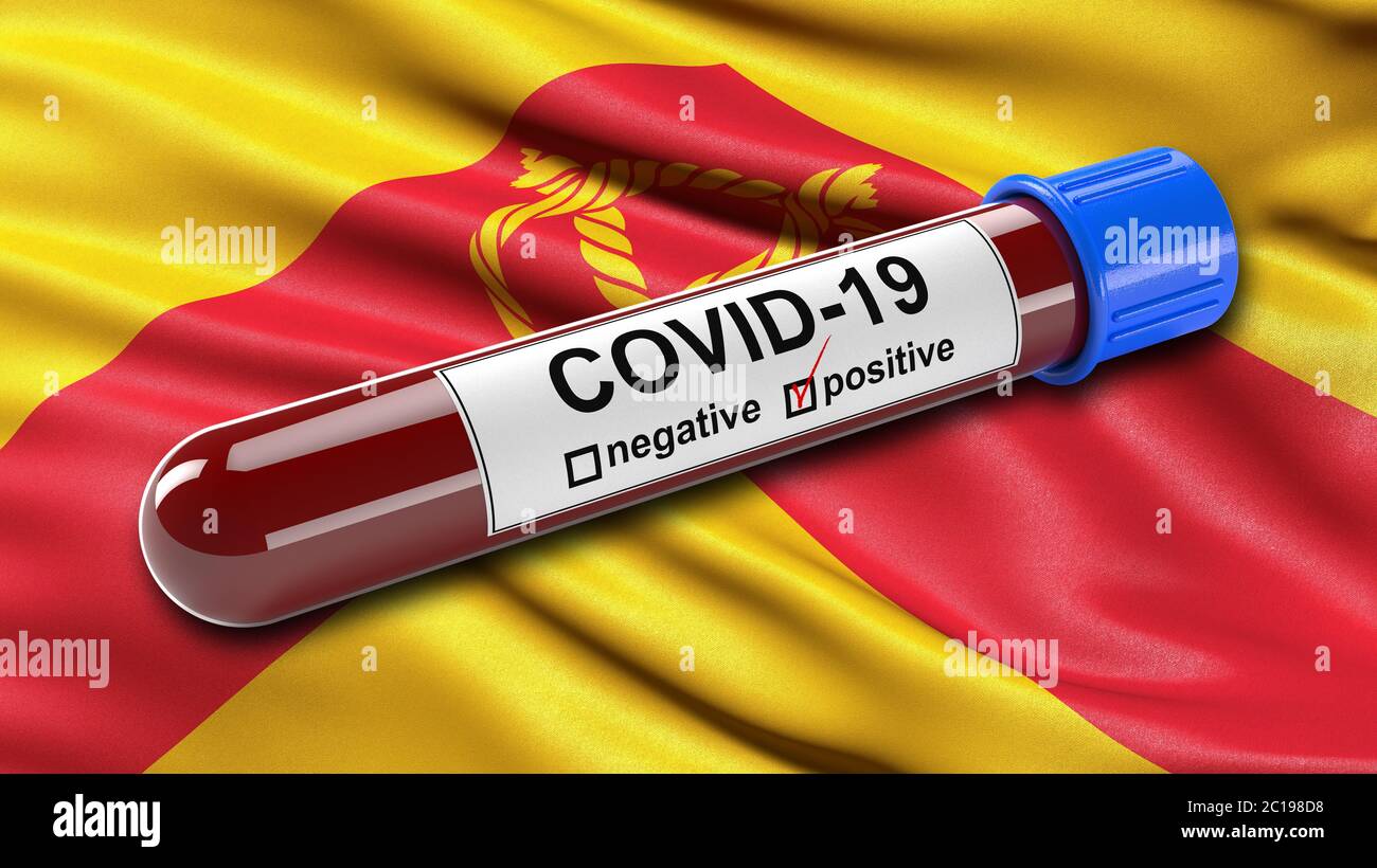 Drapeau de Staffordshire agitant dans le vent avec un tube de test sanguin Covid-19 positif. Banque D'Images