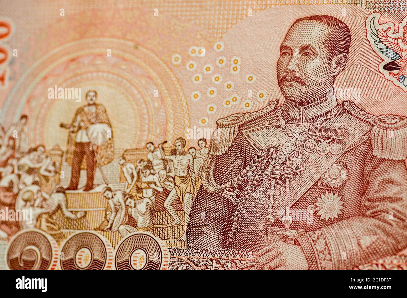 Détail d'un billet de banque de 100 baht de Thaïlande montrant sa Majesté le Roi Chulalongkorn (Rama V) en uniforme de marine et aussi dans une scène marquant l'abolition Banque D'Images